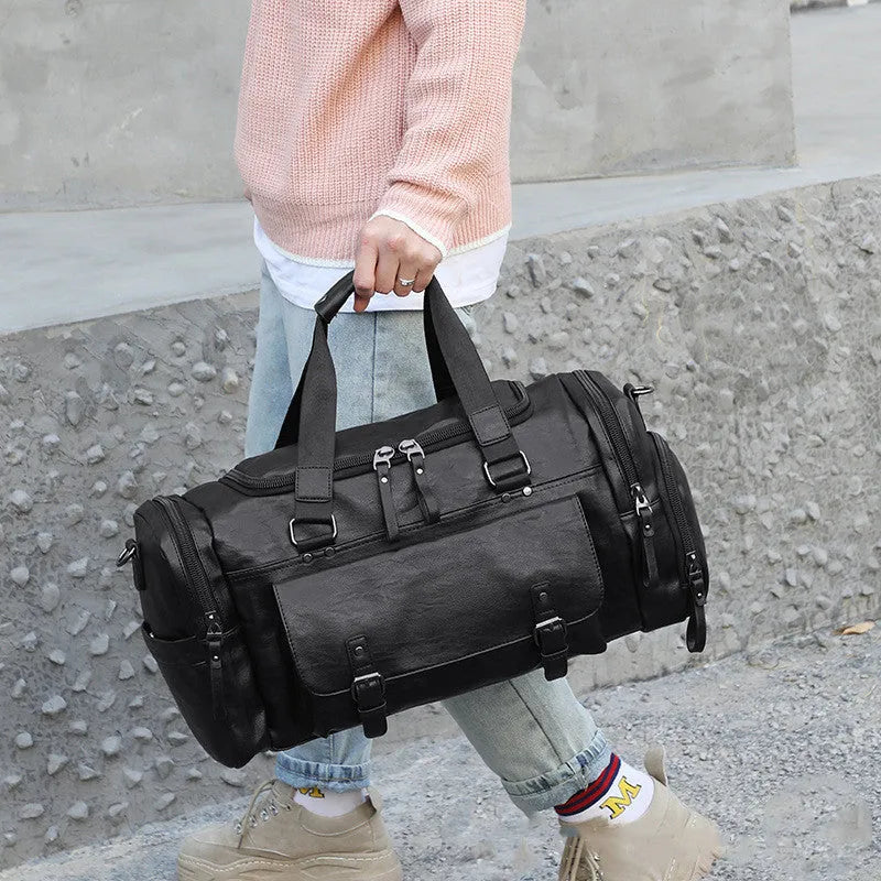 Black waterproof travel bag with separate shoe compartment and internal organisers.