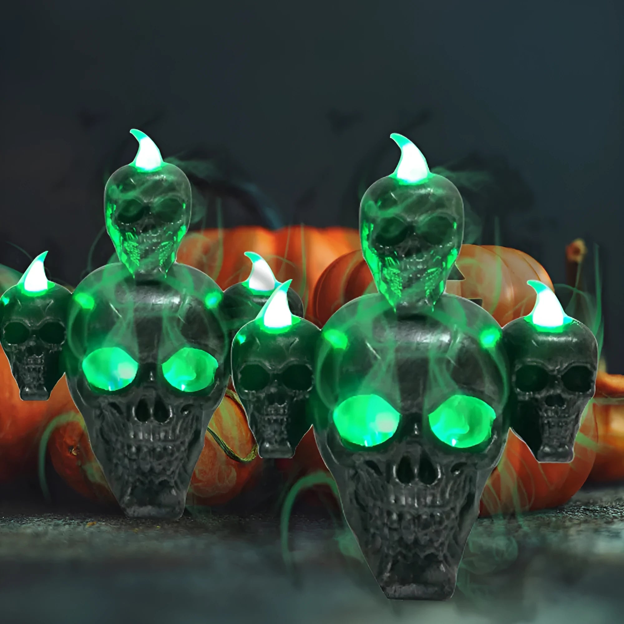 Golden skull ornament with LED light shaped like a skeleton hand holding a candle