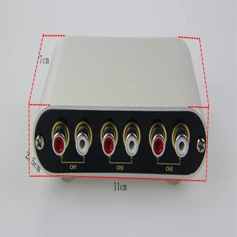 Silver aluminium audio source selector switch unit with front panel button and infrared remote.