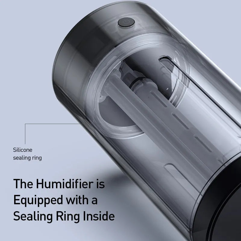 Black aluminium alloy car diffuser humidifier with USB cable on a car dashboard.