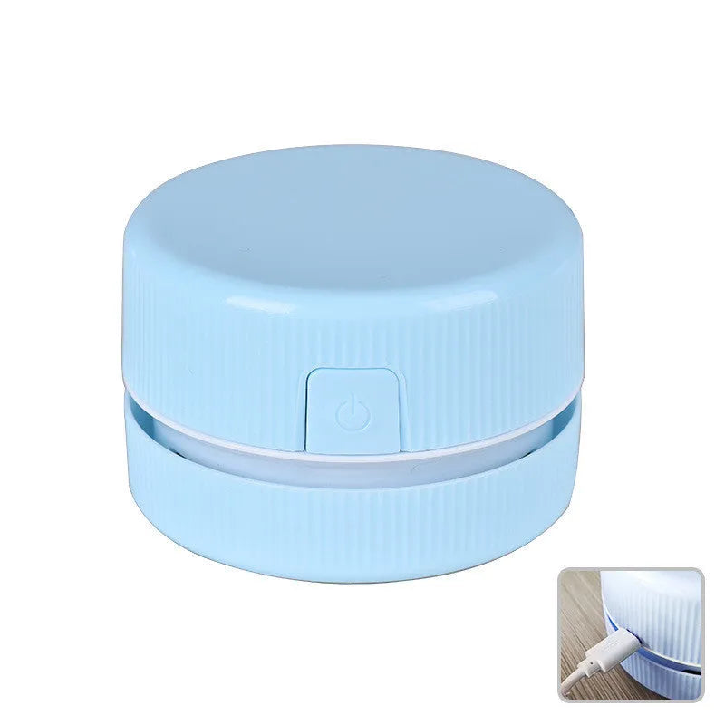 Blue and pink portable mini desktop vacuum cleaner for pencil shavings and small debris