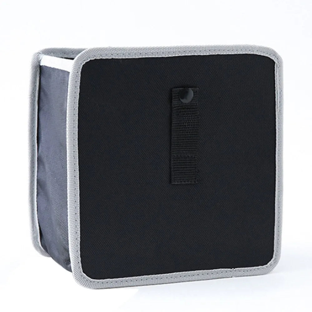 Foldable Oxford car wastebasket 22x22x15cm hanging from car seat with snap closures