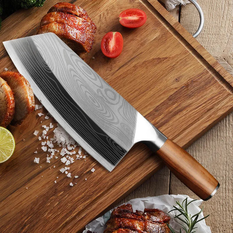A stainless steel kitchen knife with a 320mm blade on a wooden cutting board.