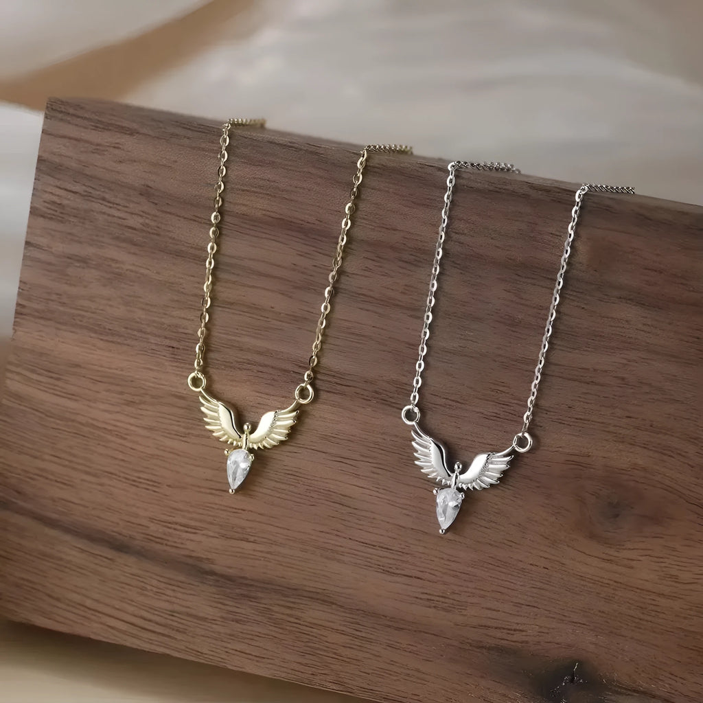 Women's sterling silver eagle pendant necklace on an adjustable O-ring chain in white gold colour.