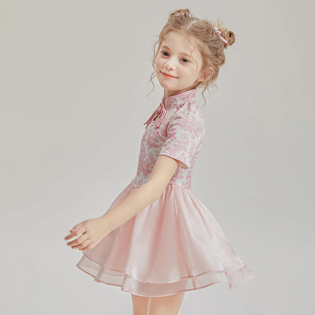 Children's casual patchwork swim shorts two-piece set with short sleeves on a neutral background.