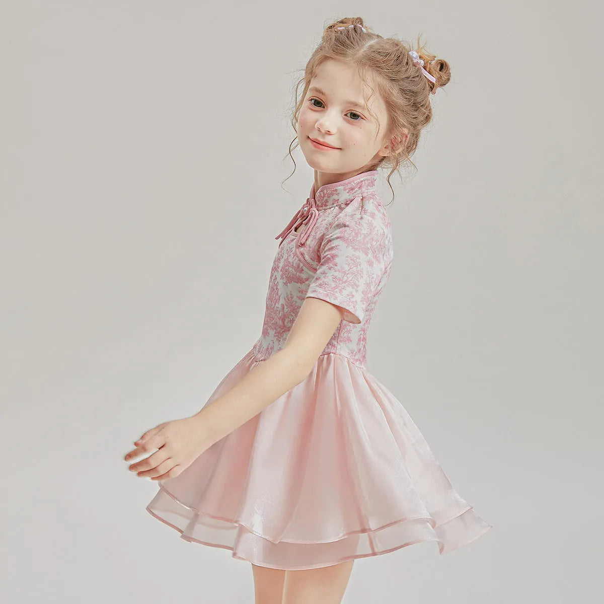 Children's casual patchwork swim shorts two-piece set with short sleeves on a neutral background.