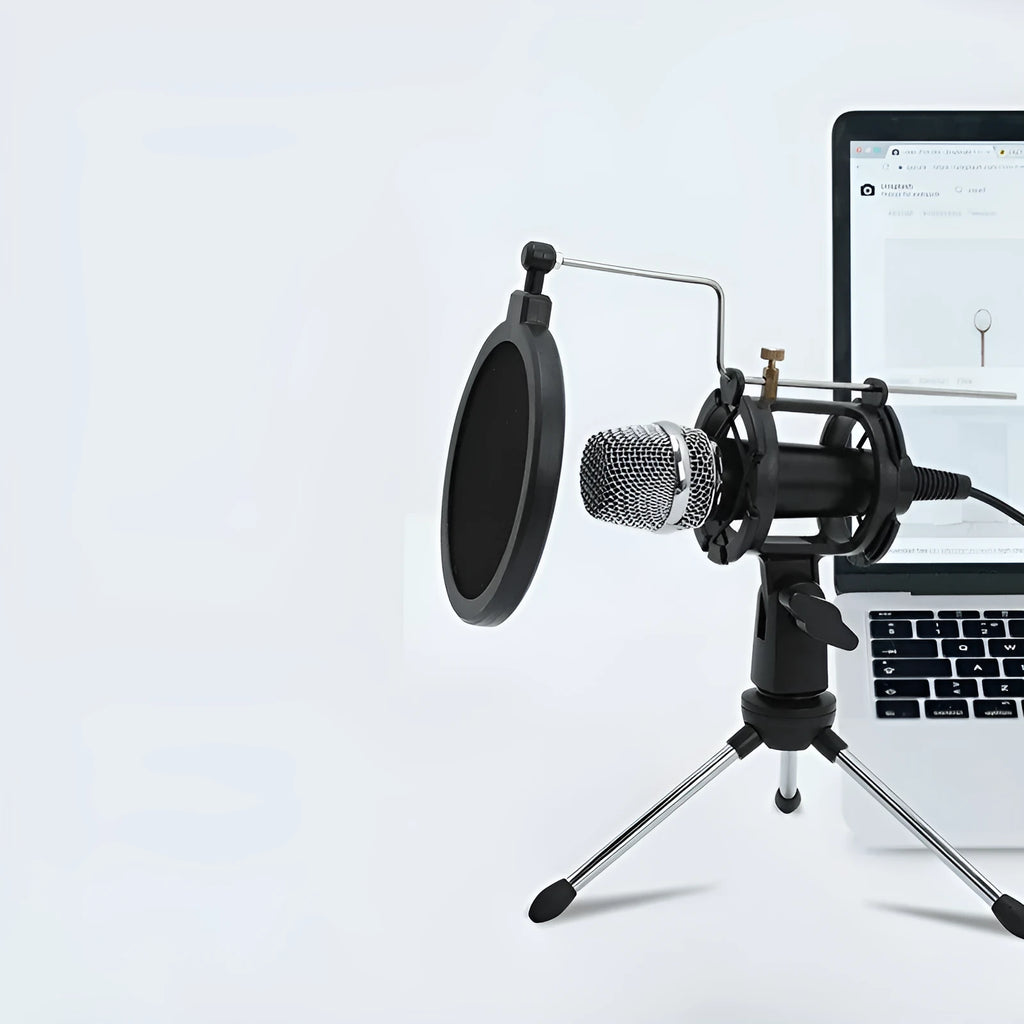 Black condenser microphone on aluminium stand with 3.5mm and USB cables for mobile and computer broadcasting
