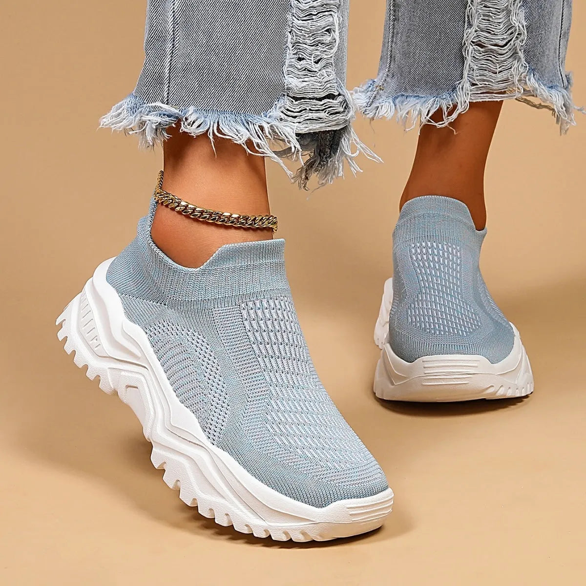 Light blue women's mesh slip-on sports shoes with woven design and round toe