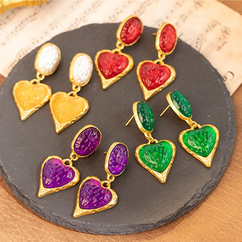 Oval love heart stud earrings with pleated texture in purple, red, green, and yellow-white colour options