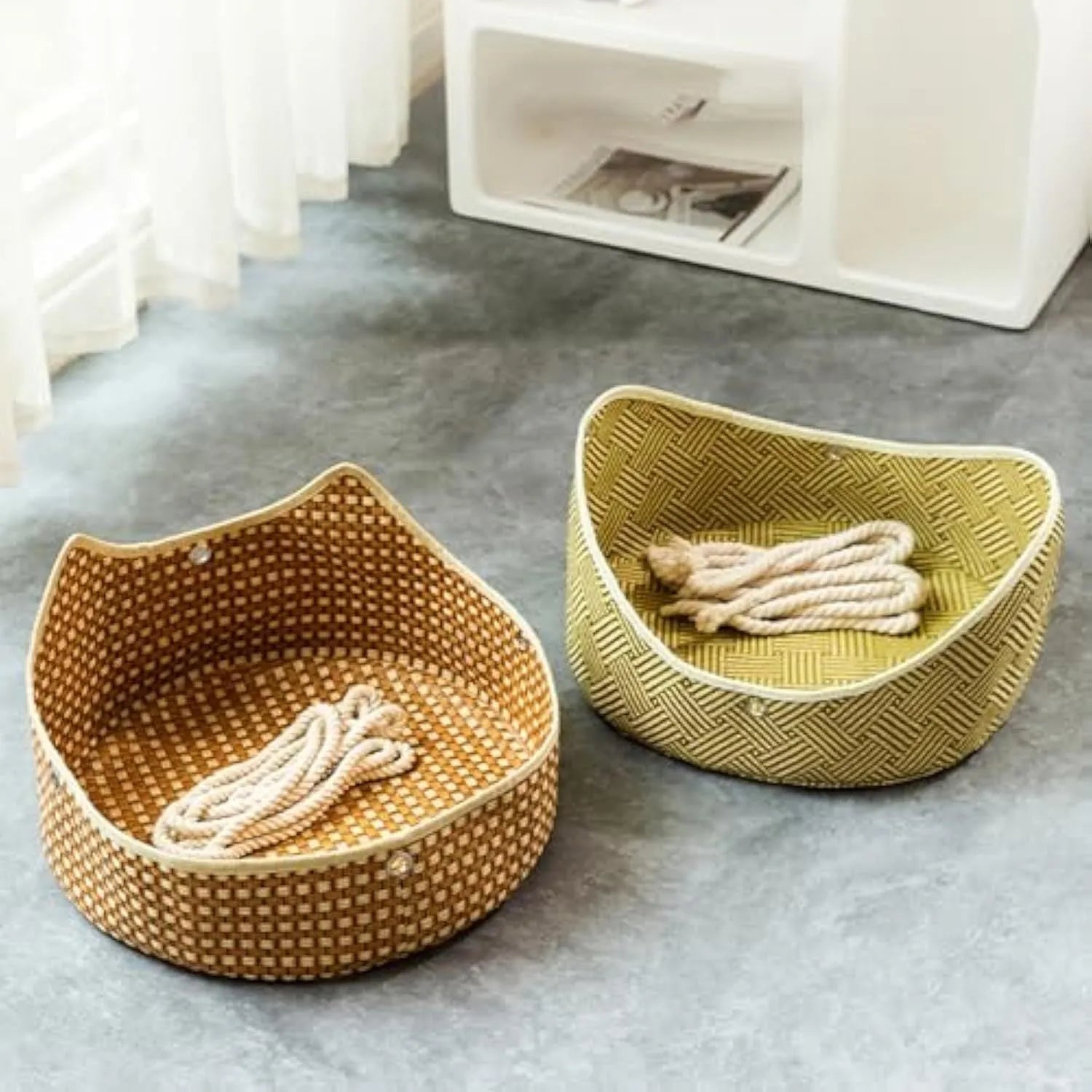 Green rattan cat cage hammock with metal hooks, shown hanging on a shelf.
