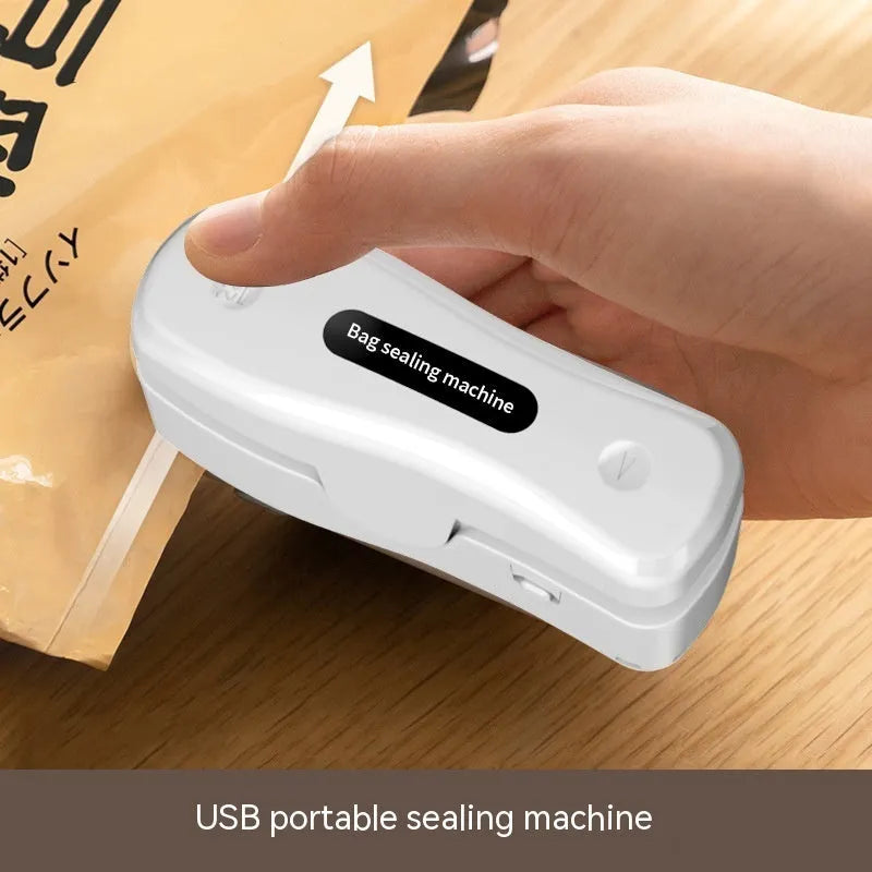Small USB rechargeable sealing machine in milky white colour with magnetic storage patches