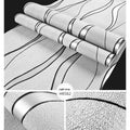 Close-up of light grey 3D curve stripe wallpaper with thick deerskin velvet texture and raised pattern.