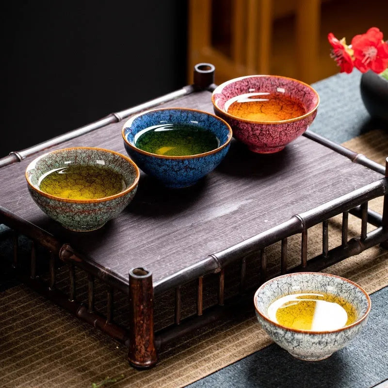 Ceramic Kung Fu tea cup set with four cups in a light-coloured new Chinese style gift box.