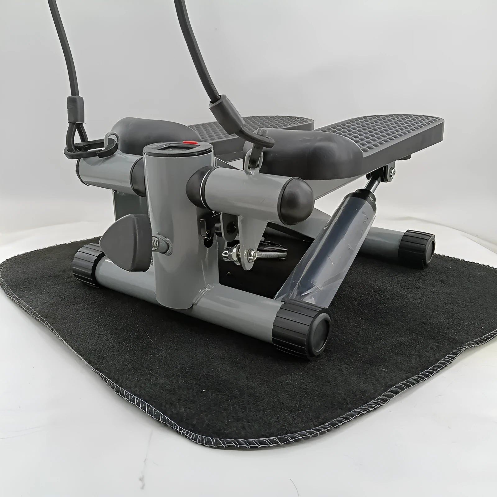 Silver grey hydraulic resistance mini treadmill pedal exerciser for home waist slimming.