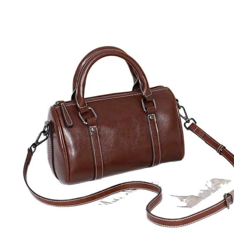 Cortex lady casual zip crossbody bag in top grain leather, cylindrical shape, shown in available colours