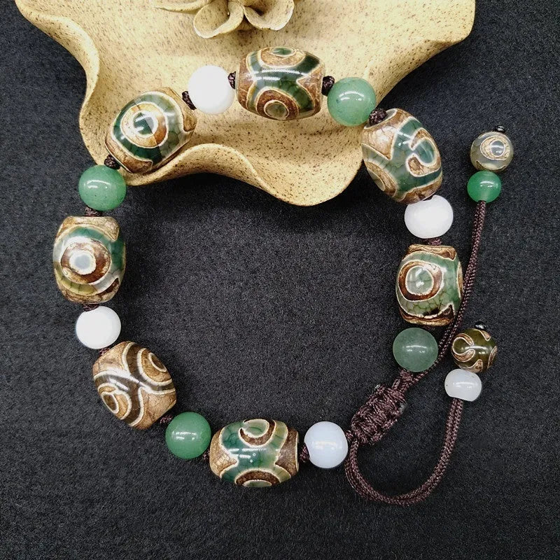 Green agate Tibetan bracelet with hand-woven three-eye geometric pattern