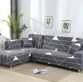 L-shaped stretch sofa cover with elastic fabric and sponge strip design on a grey sofa