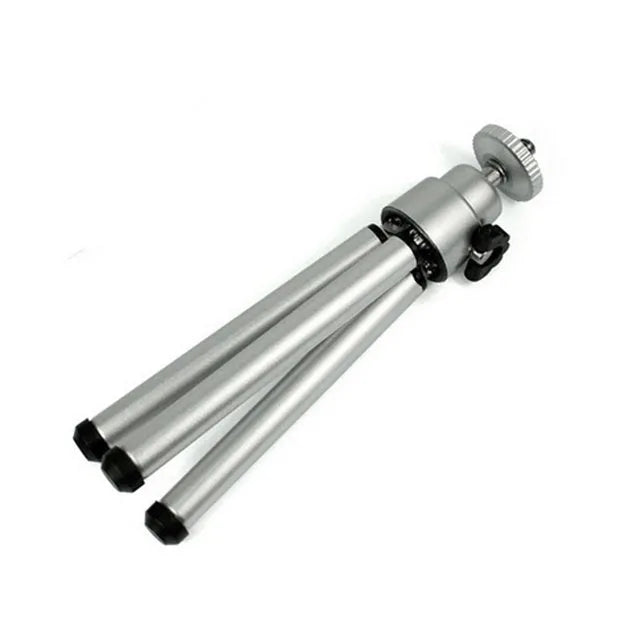 Mini flexible aluminium desktop tripod with ball head extended, alongside a universal U-shaped black phone clip.