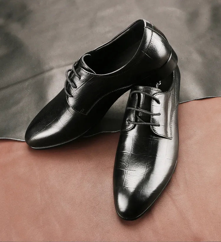 Men's black checkered leather derby shoes with a pointed toe and rubber sole.
