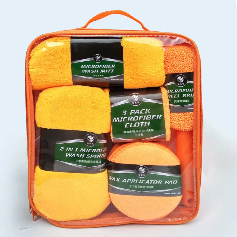 9-piece car wash cleaning kit with polyamide towels, sponge, tyre brush, and waxing cakes in dark grey and orange