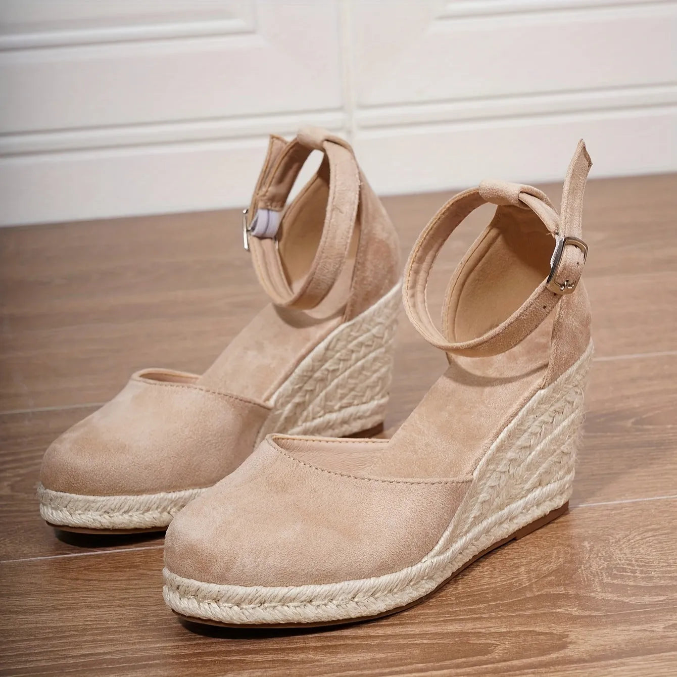 Women's apricot and black canvas wedge sandals with suede detail and a buckle fastening.