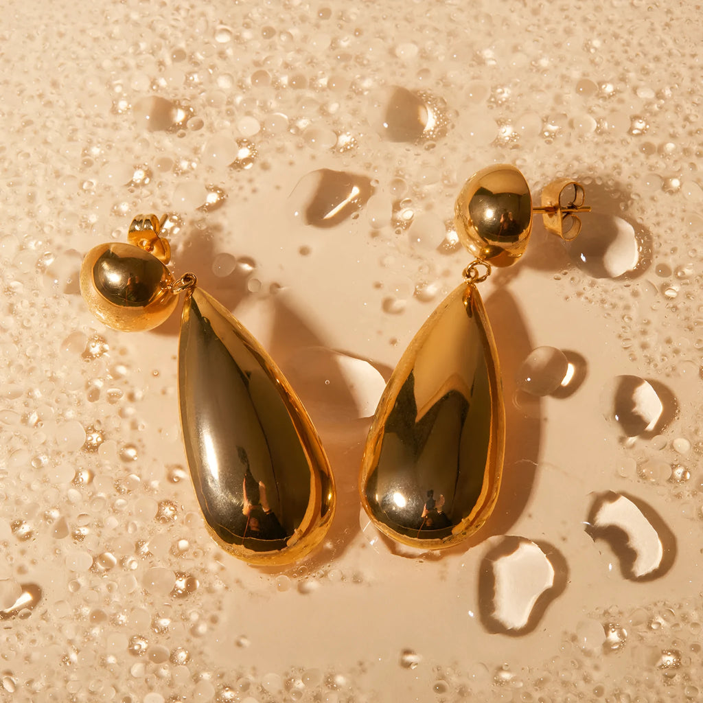 Gold geometric hemisphere water drop pendant earrings made from stainless steel.