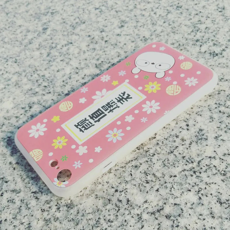 Clear transparent TPU phone case with example custom print on back, showing phone model cutouts.