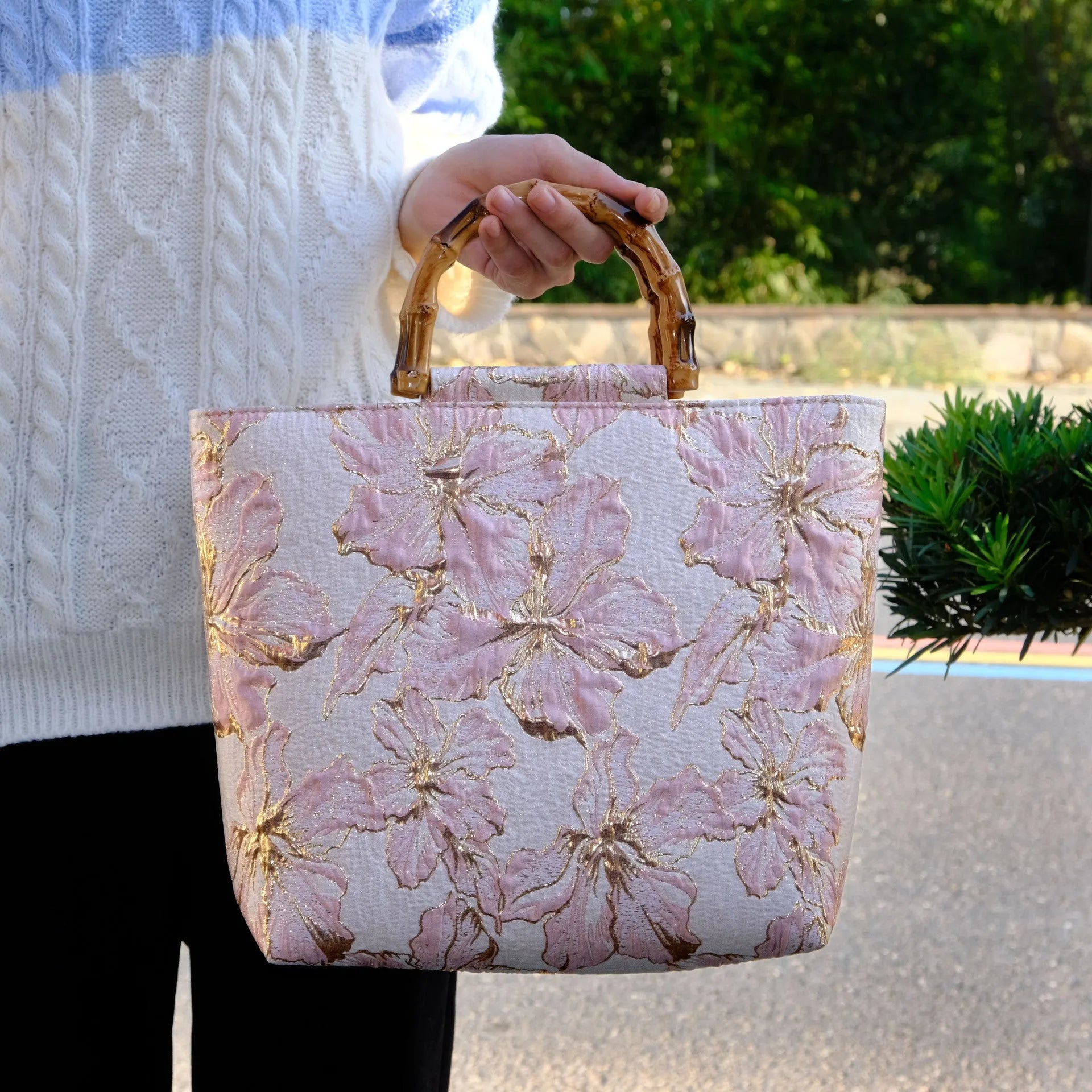 Light blue canvas shoulder bag with gold floral pattern showing 30x30x10 cm dimensions and double straps