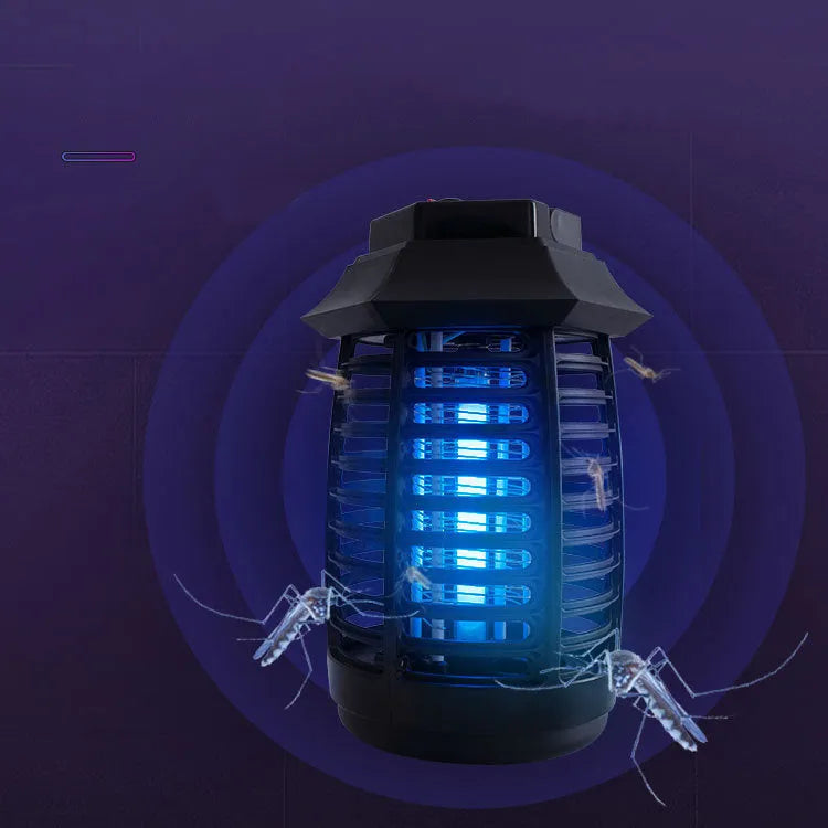 Black aromatherapy mosquito lamp with UV tube and metal grid on a table.