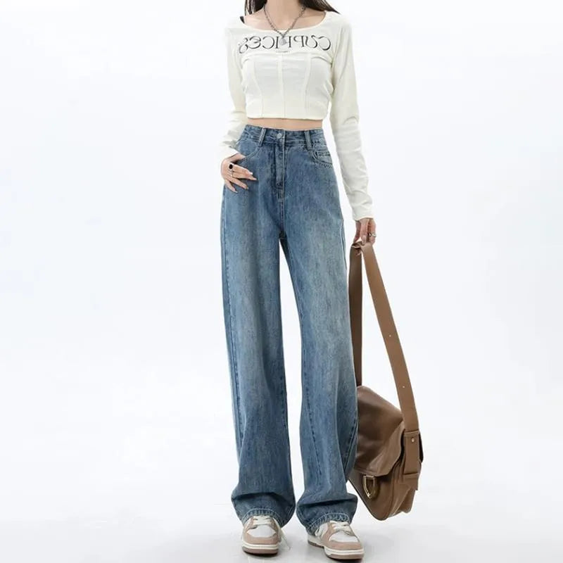 Women's retro blue high-waisted wide-leg denim jeans on a hanger, showing the straight-leg cut.