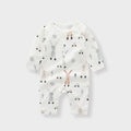Baby wearing a soft bamboo fibre jumpsuit with a cute Nordic animal print, long sleeves.