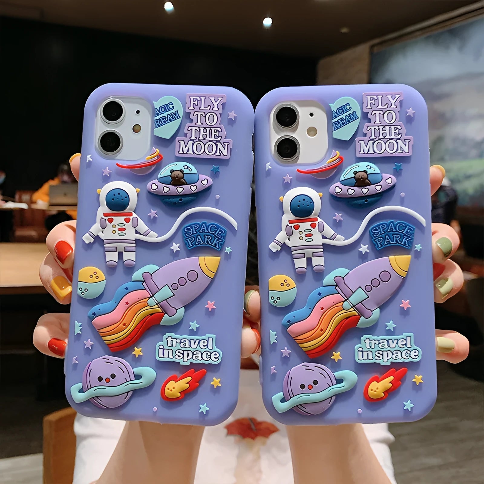 Purple silicone iPhone case with cartoon astronaut design for multiple models