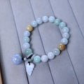 Natural emerald green jade bracelet with silver-plated hanging charms including Maitreya Buddha