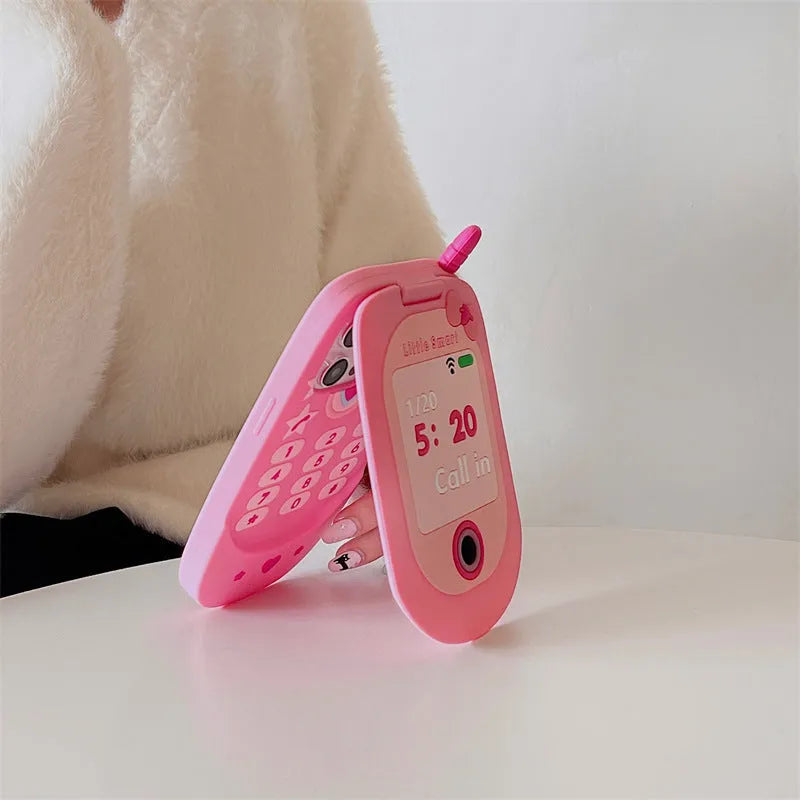 Light pink silicone flip phone case for iPhone with a built-in cosmetic mirror on the front.