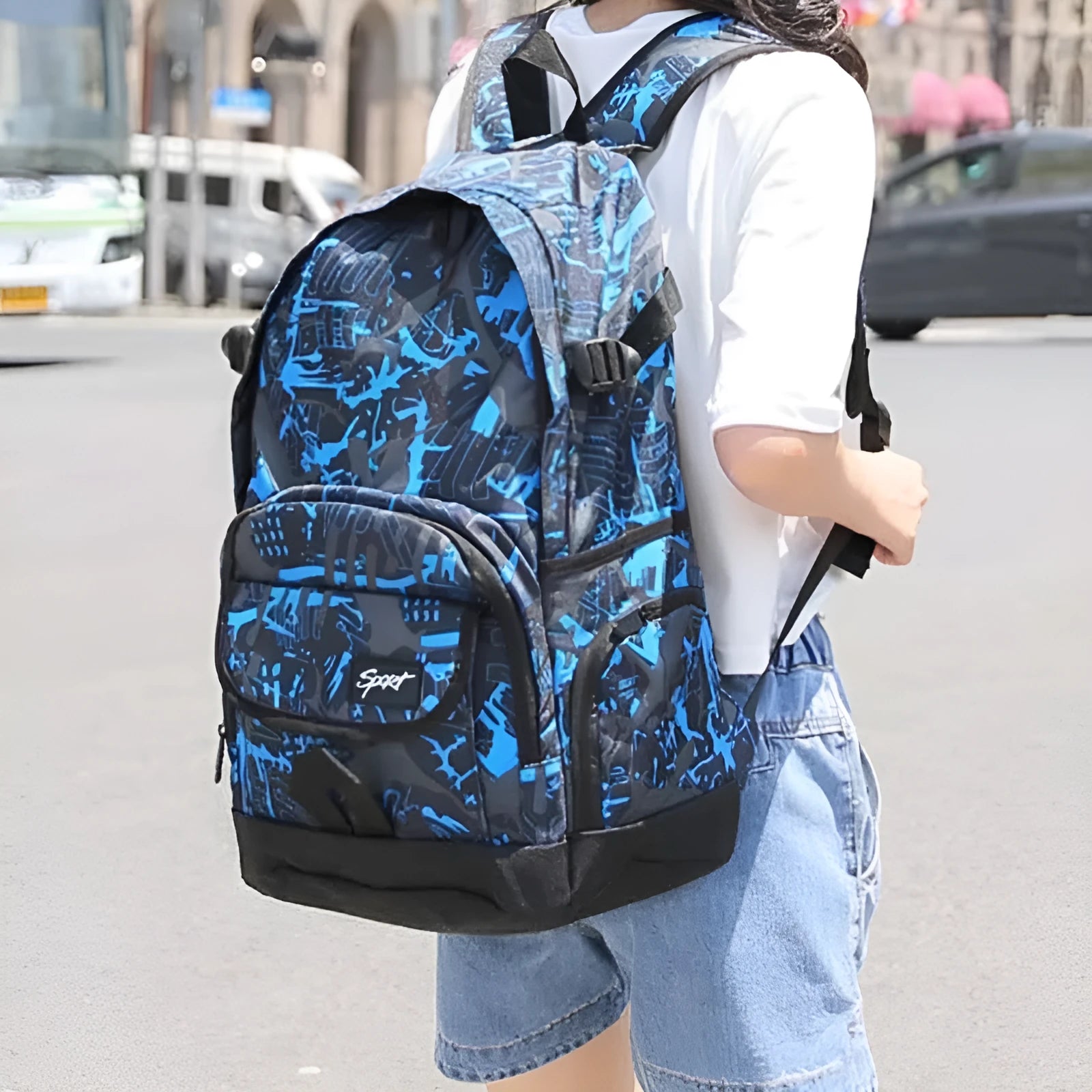 Blue classic nylon backpack with large main compartment and adjustable shoulder straps.