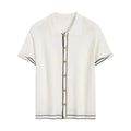 White short sleeve cardigan with dark contrast lapels, buttoned front, and a soft drape fabric.