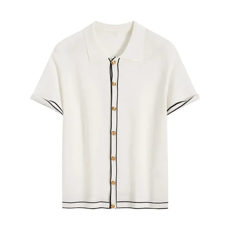 White short sleeve cardigan with dark contrast lapels, buttoned front, and a soft drape fabric.