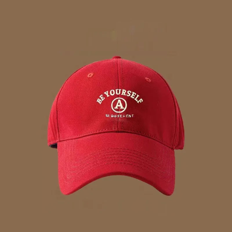 Cotton baseball cap with embroidered couple face, adjustable head circumference, available in six colours