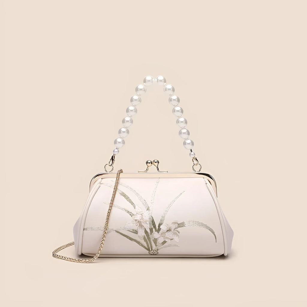 Beige women's shoulder bag with embroidery detail and shell-shaped design in soft PU leather