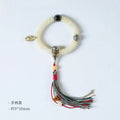 Close-up of a White Bodhi seed bracelet or handheld strand showing 3x10mm natural beads.