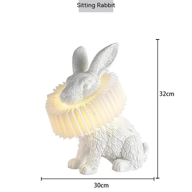Modern customisable bedside lamp with choice of white or black rabbit silhouette designs.