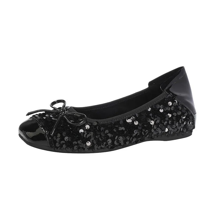 Women's black satin Mary Jane pump with height increasing insole, rhinestones, buckle, and square toe