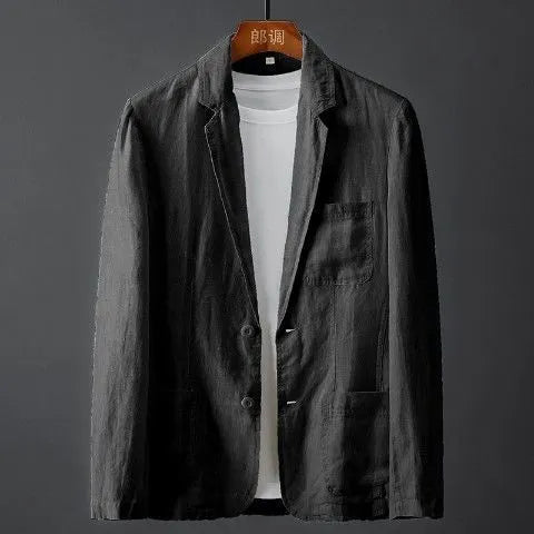 Men's solid colour slim fit linen suit jacket with nine-point sleeves on a hanger.