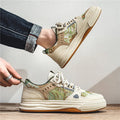 Men's casual canvas sneaker in Milan green with flat heel and round toe on a white background.