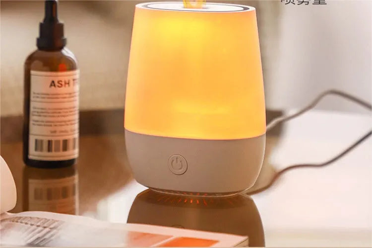 White USB aromatherapy diffuser with simulated flame effect showing mist output