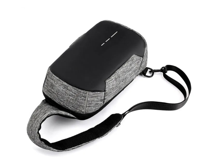 Dark blue Oxford cloth chest bag with adjustable strap, worn across the chest, showing front zipper and square shape.