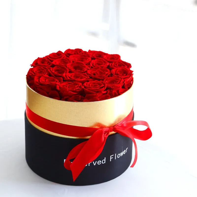 Luxury gift box open to display preserved real red roses, a Valentine's Day gift set.