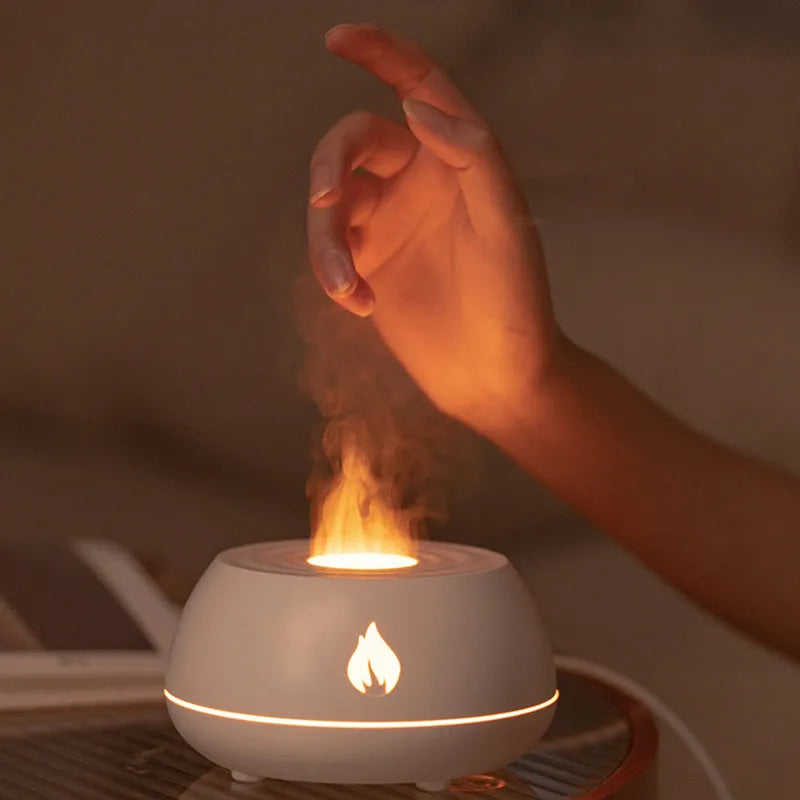 Black flame effect humidifier diffuser with LED lights on a wooden surface