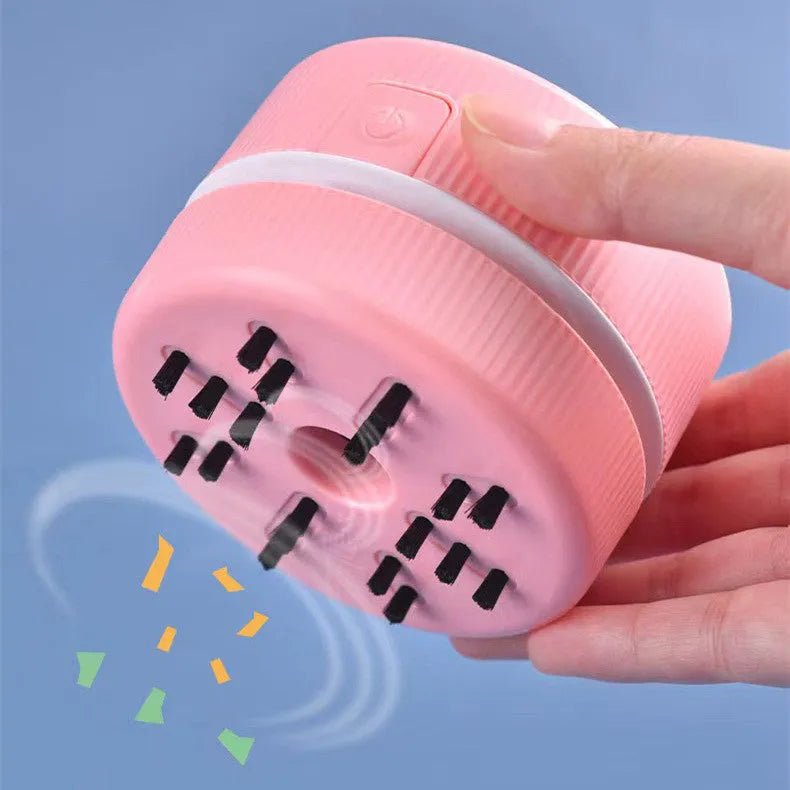 Blue and pink portable mini desktop vacuum cleaner for pencil shavings and small debris