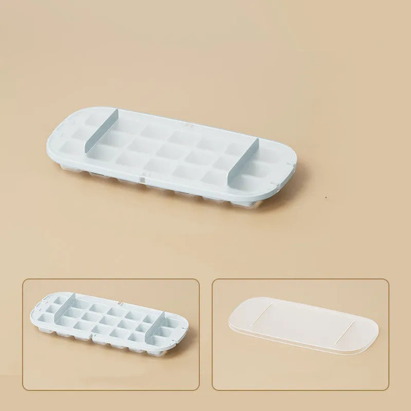 High-capacity ice cube tray ice box grid in blue with an ice shovel stored in its slot.